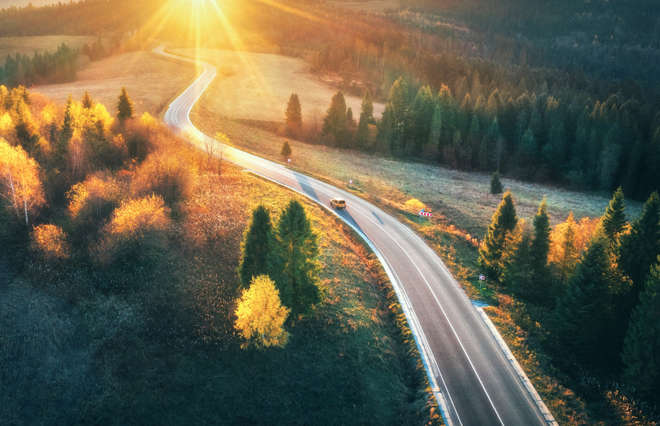 Man and woman laughing while painting