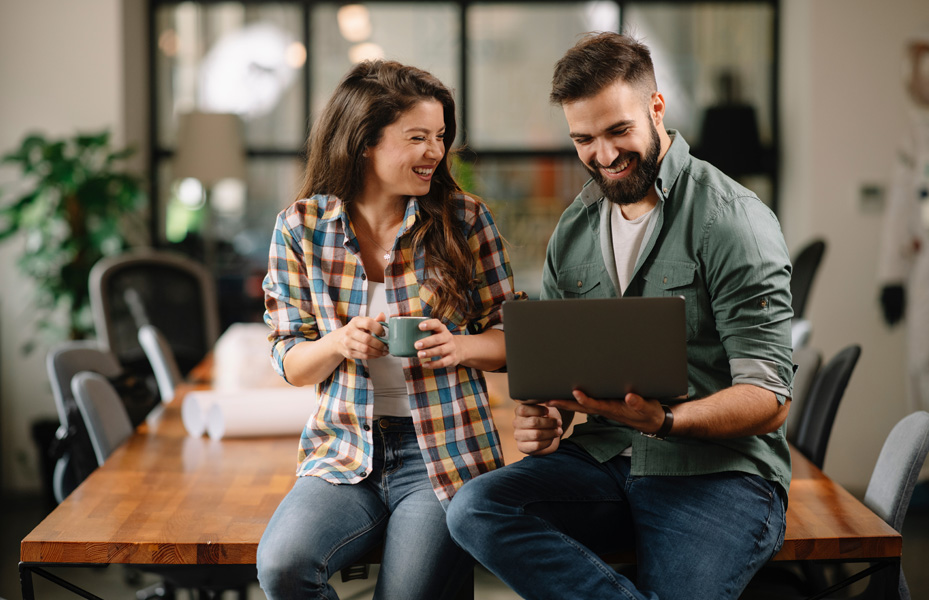 Man and woman on a laptop 