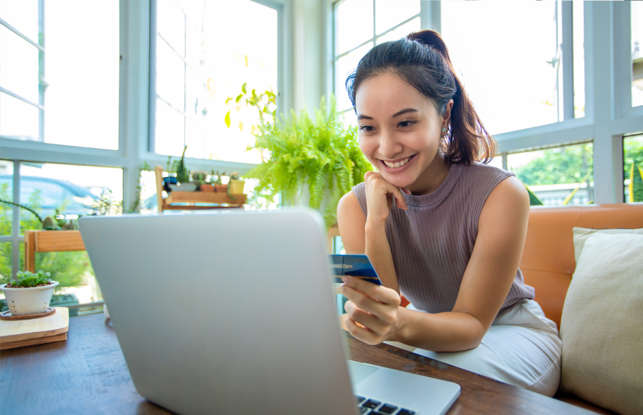 Woman on laptop with credit card