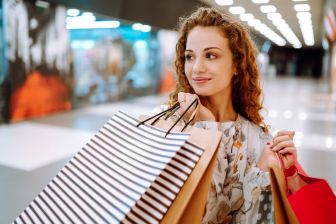 Woman holding bags in a mall