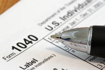 Tax Form 1040 with a Pen