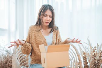 Woman with a box confused