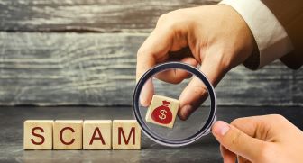 Scam written on blocks