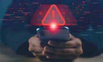 Holding phone with exclamation point message